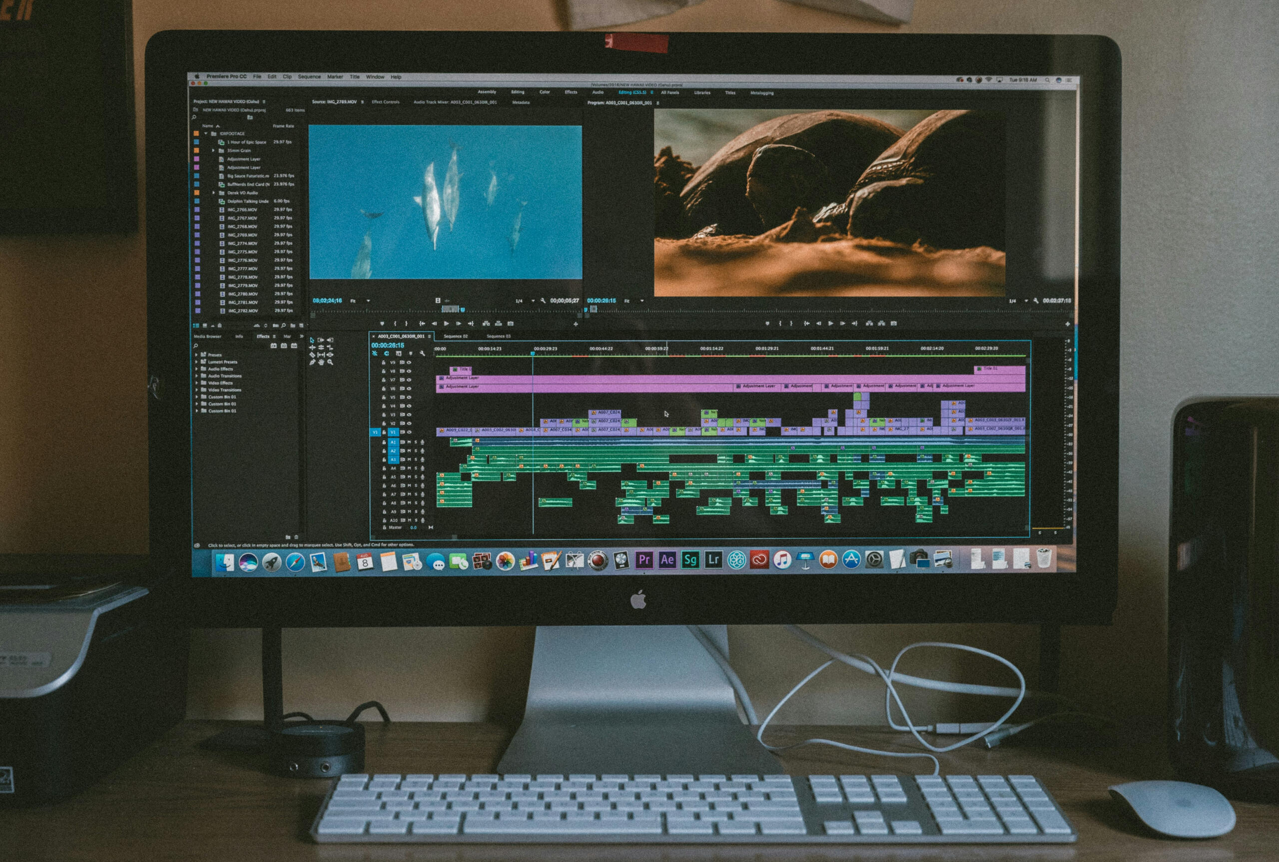 Photograph of a computer where a video is being edited in Adobe Premiere Pro